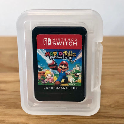 Cartridge of Mario + Rabbids Kingdom Battle for Nintendo Switch, the cartridge is inside a cartridge size transparent protective case, through which you can see the front of the cartridge