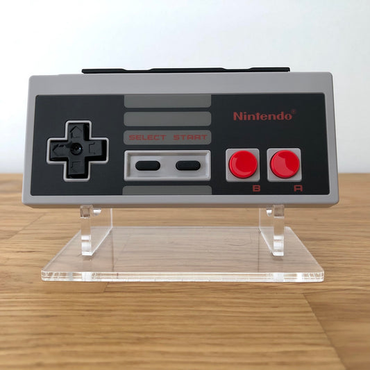 Front view of Nintendo Switch NES Online Controller, showing button layout and design.