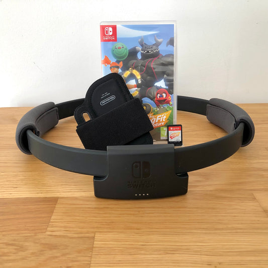 Front case cover, ring and leg strap of Ring fit adventure for Nintendo Switch, featuring game artwork, title, and front of cartridge.