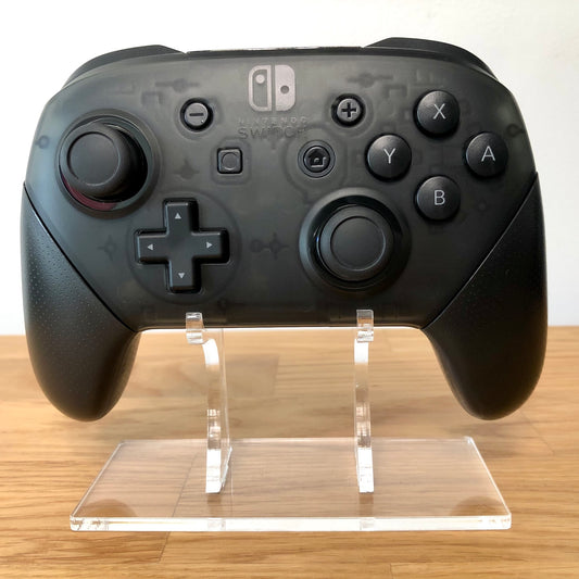 Front view of Nintendo Switch Pro Controller, showing button layout and ergonomic design.