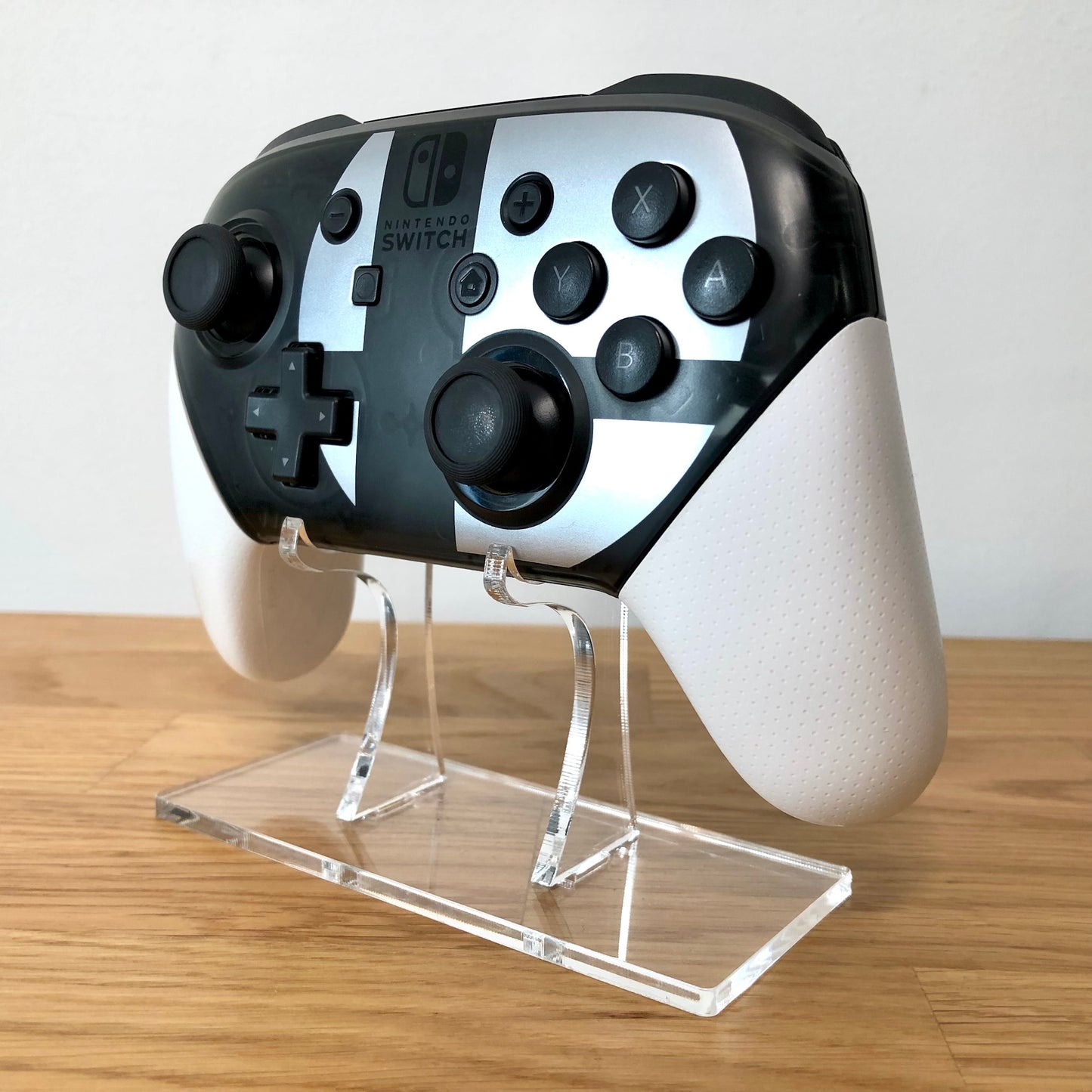 Nintendo Switch Pro controller: Smash bros. Edition, angled right view showing all the face buttons 