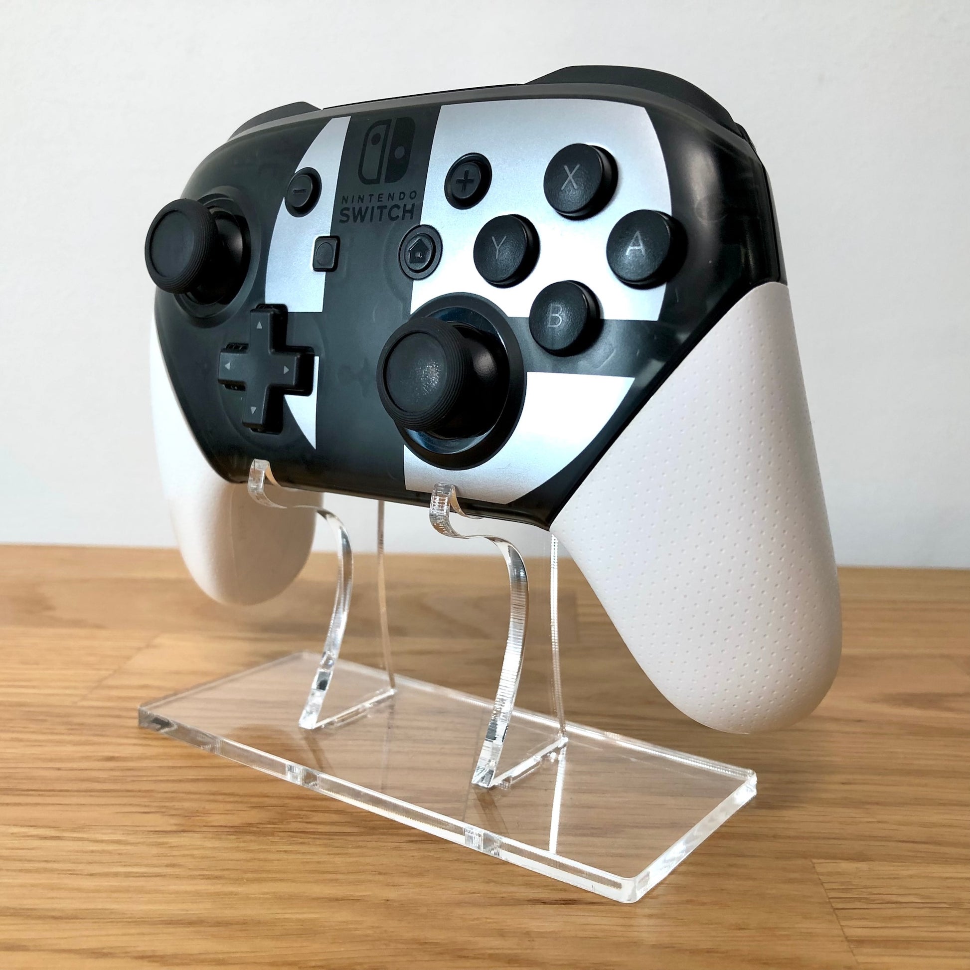 Nintendo Switch Pro controller: Smash bros. Edition, angled right view showing all the face buttons 