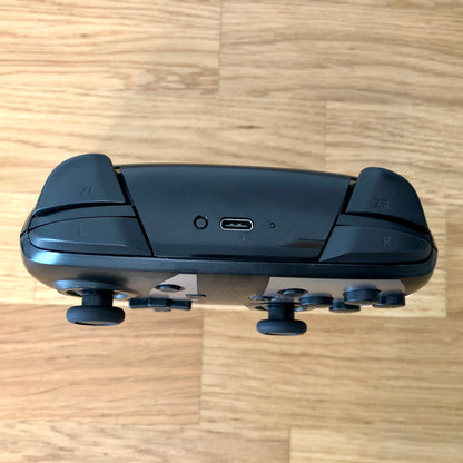 Birds eye top view of Nintendo Switch Pro Controller, highlighting shoulder buttons.