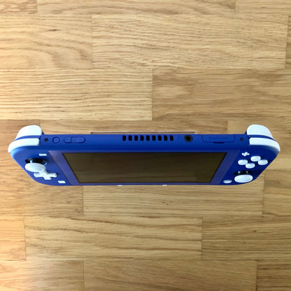 op view of blue Nintendo Switch Lite console showing volume, power, headphone jack and game card slot.