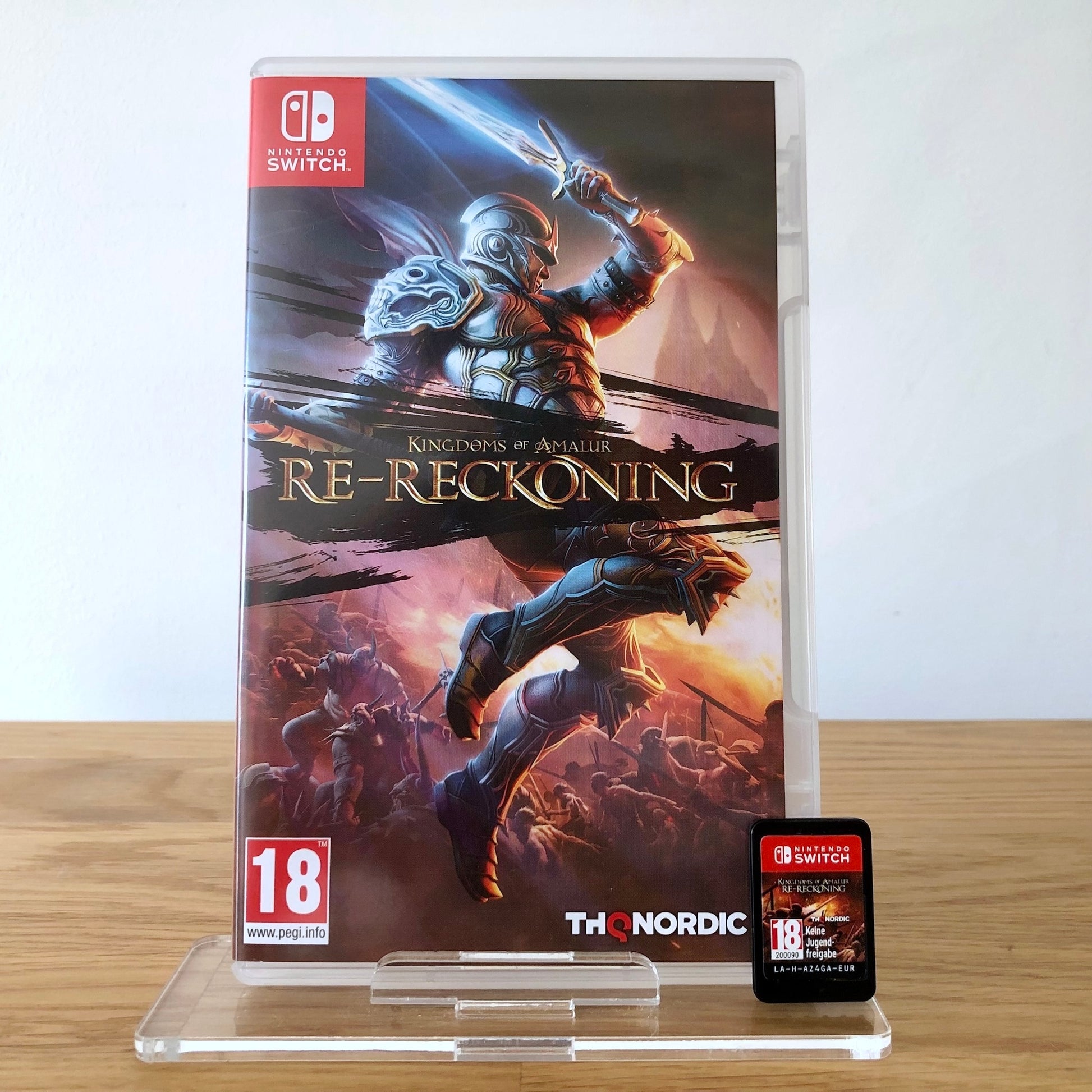 Front cover of Kingdoms of Amalur: Re-Reckoning for Nintendo Switch, featuring game artwork, title, and front of cartridge.