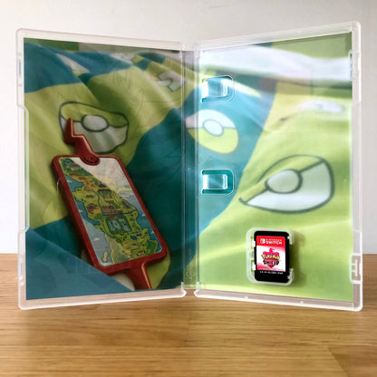 Inside the case of Pokémon Shield for Nintendo Switch, showing the cartridge and case design.