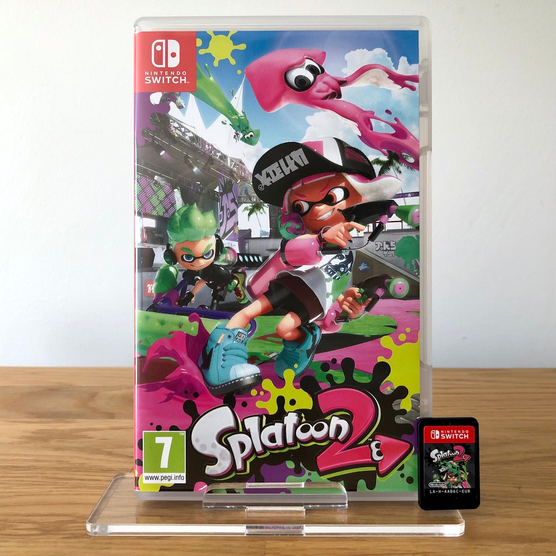 Front cover of Splatoon 2 for Nintendo Switch, featuring game artwork, title, and front of cartridge.