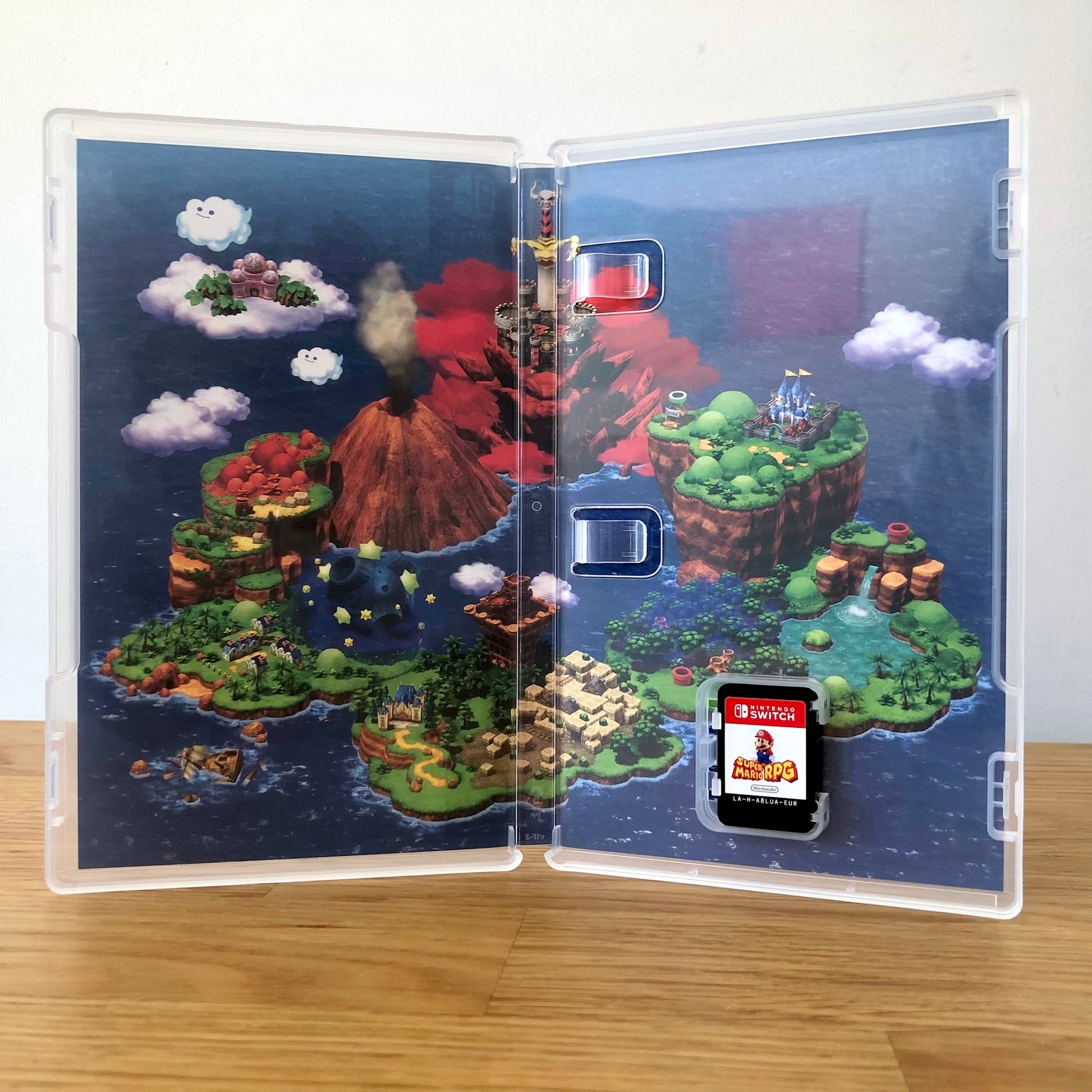 Inside the case of Super Mario RPG for Nintendo Switch, showing the cartridge and case design.