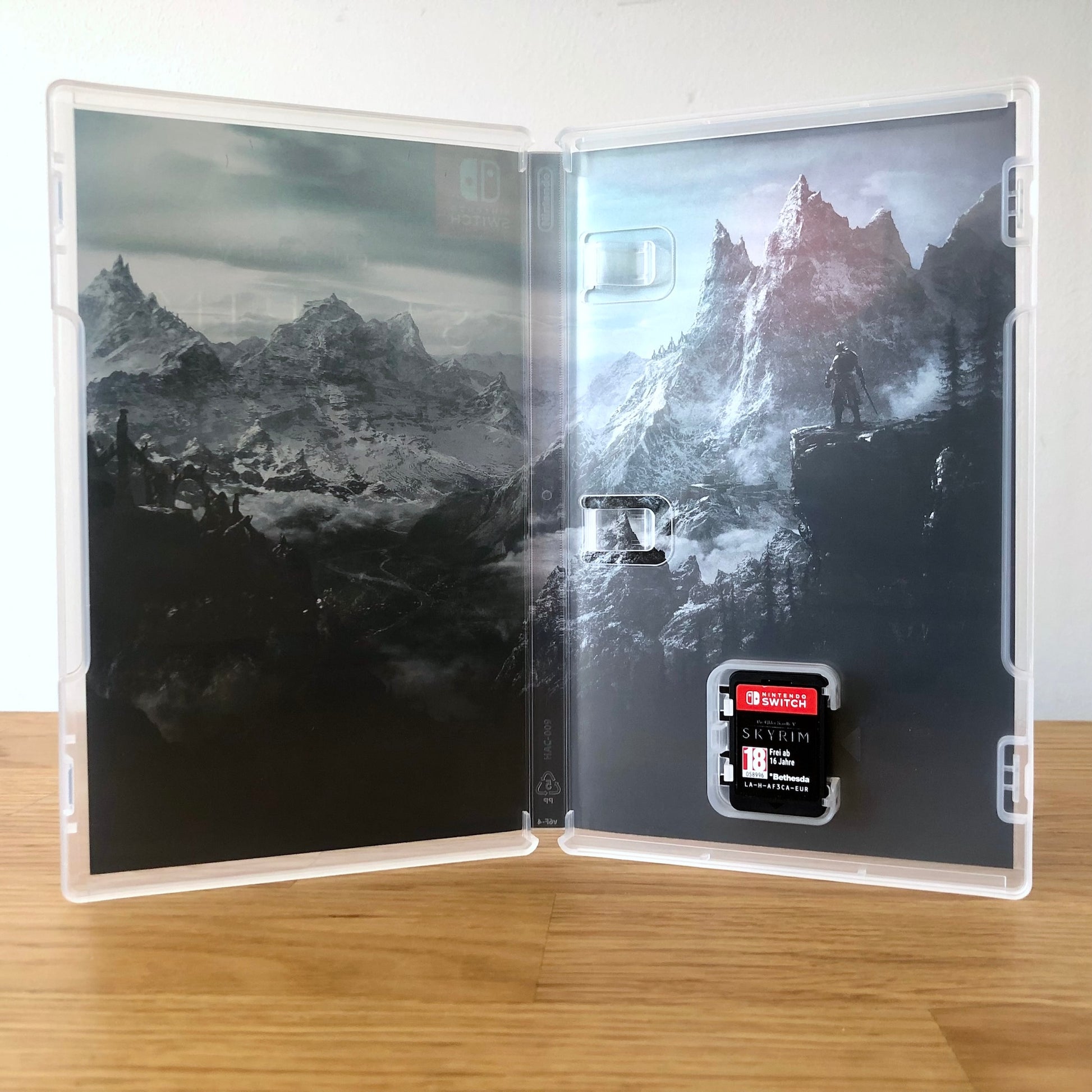 Inside the case of The Elder Scrolls V: Skyrim for Nintendo Switch, showing the cartridge and case design.