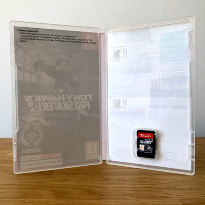 Inside the case of Tony Hawk's Pro Skater 1 + 2 for Nintendo Switch, showing the cartridge and case design.